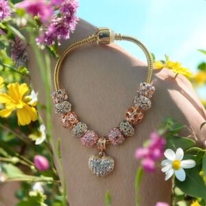 Elegant Gold and Pink Charm Bracelet